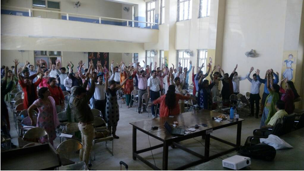 Large group yoga session in main hall