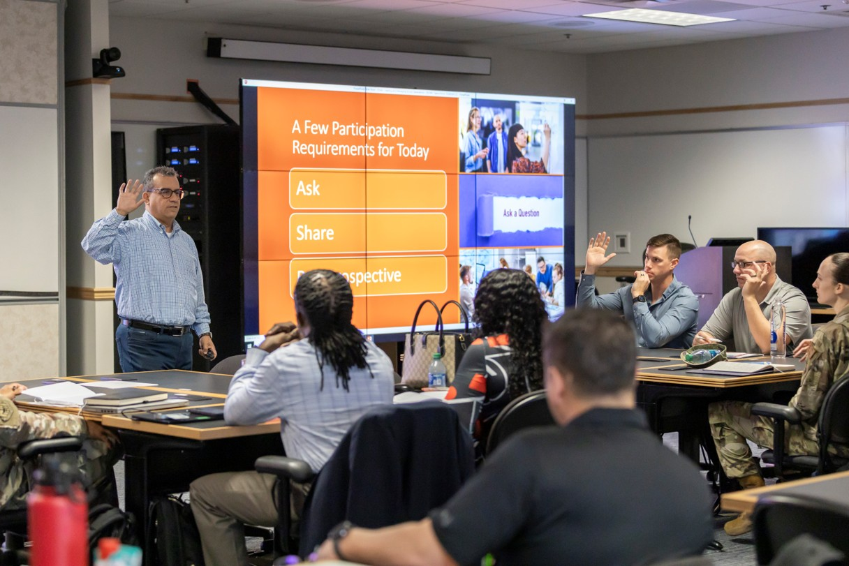 Jeffrey Vargas actively facilitating an interactive leadership development workshop with military personnel and professionals