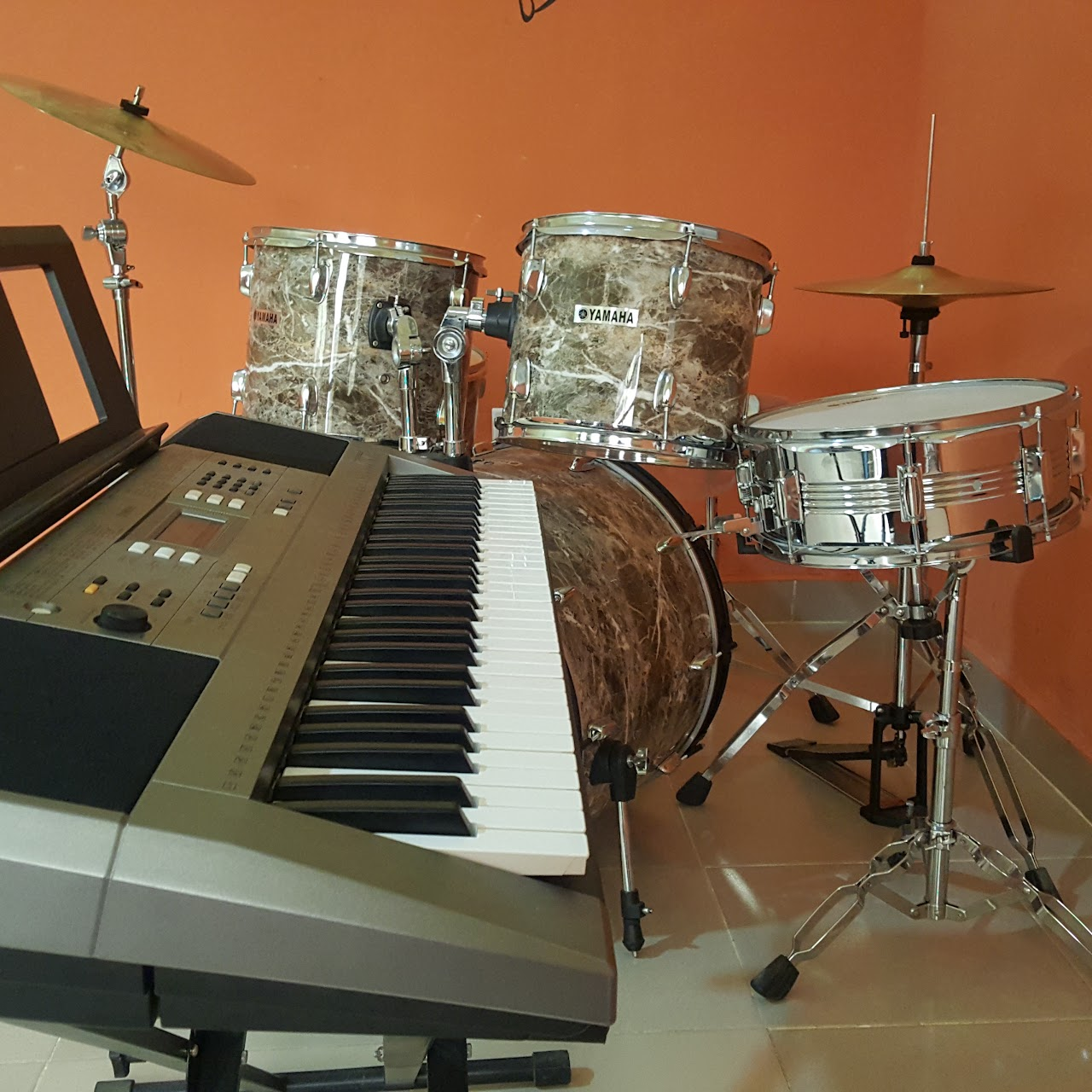 Music room with a Yamaha drum kit and keyboard