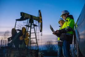Oil workers collaborating in the field