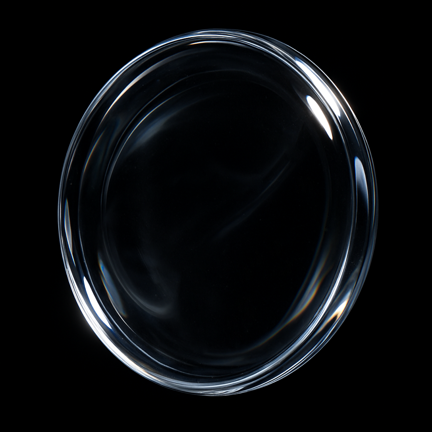 Glass base material — transparent disc with subtle refraction and light dispersion on black background