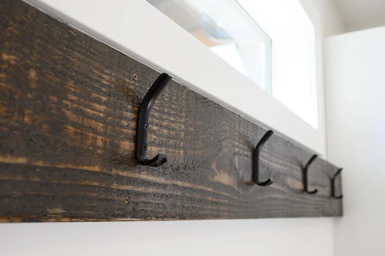 Mudroom with reclaimed wood and coat hooks