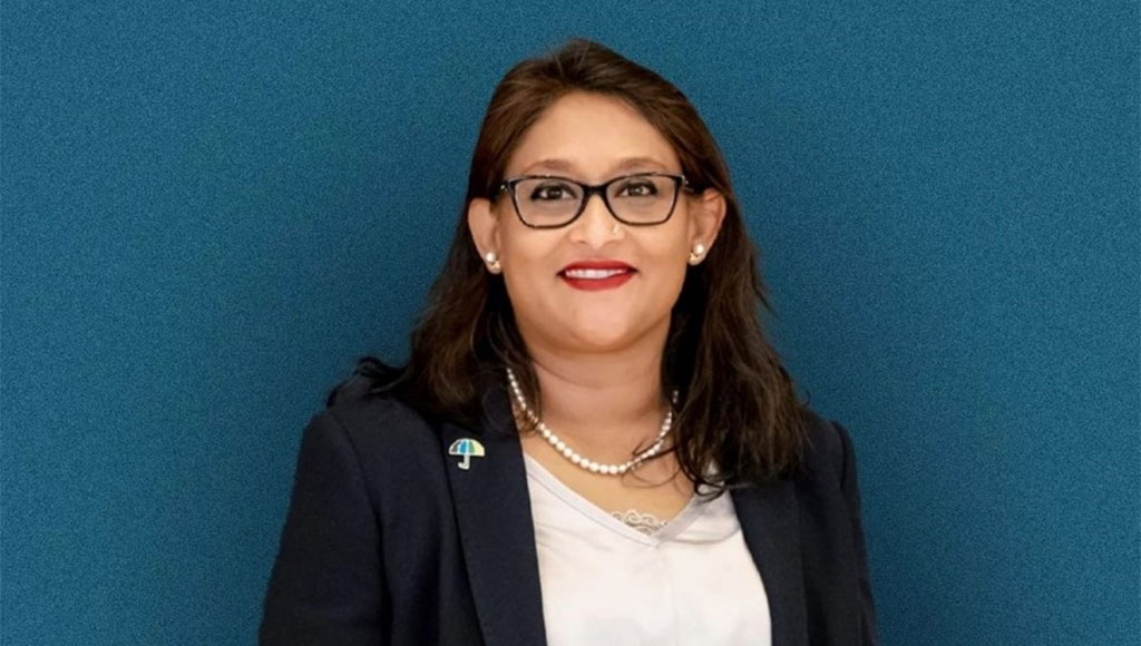 Portrait of Saima Wazed against a blue background