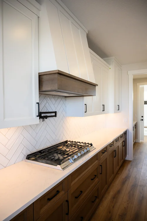 Kitchen range with custom hood