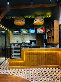 WaB Cafe ordering counter with LED lighting and menu screens