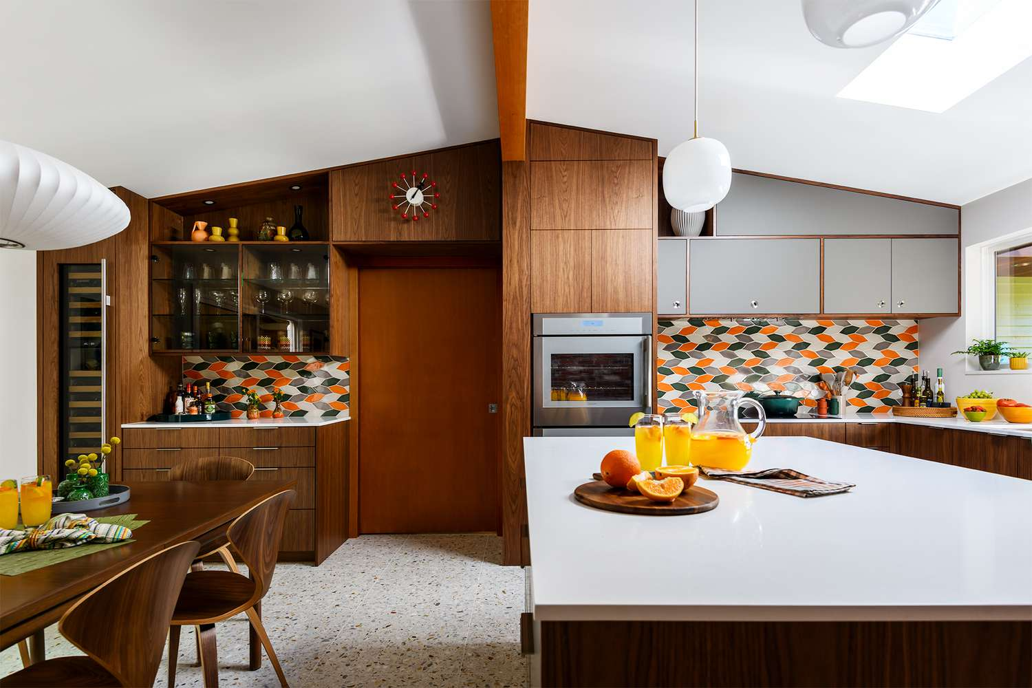 Mid-century walnut kitchen with colorful chevron tile