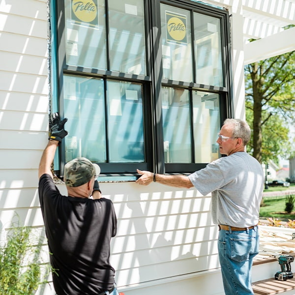 Professional window contractors installing Pella windows