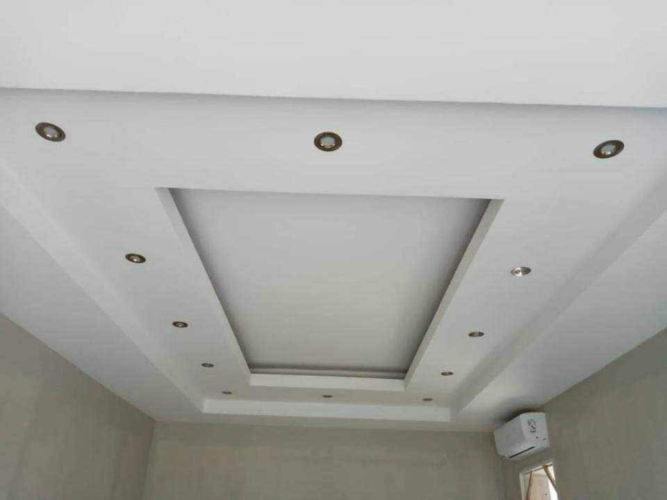 White coffered ceiling with recessed spotlights