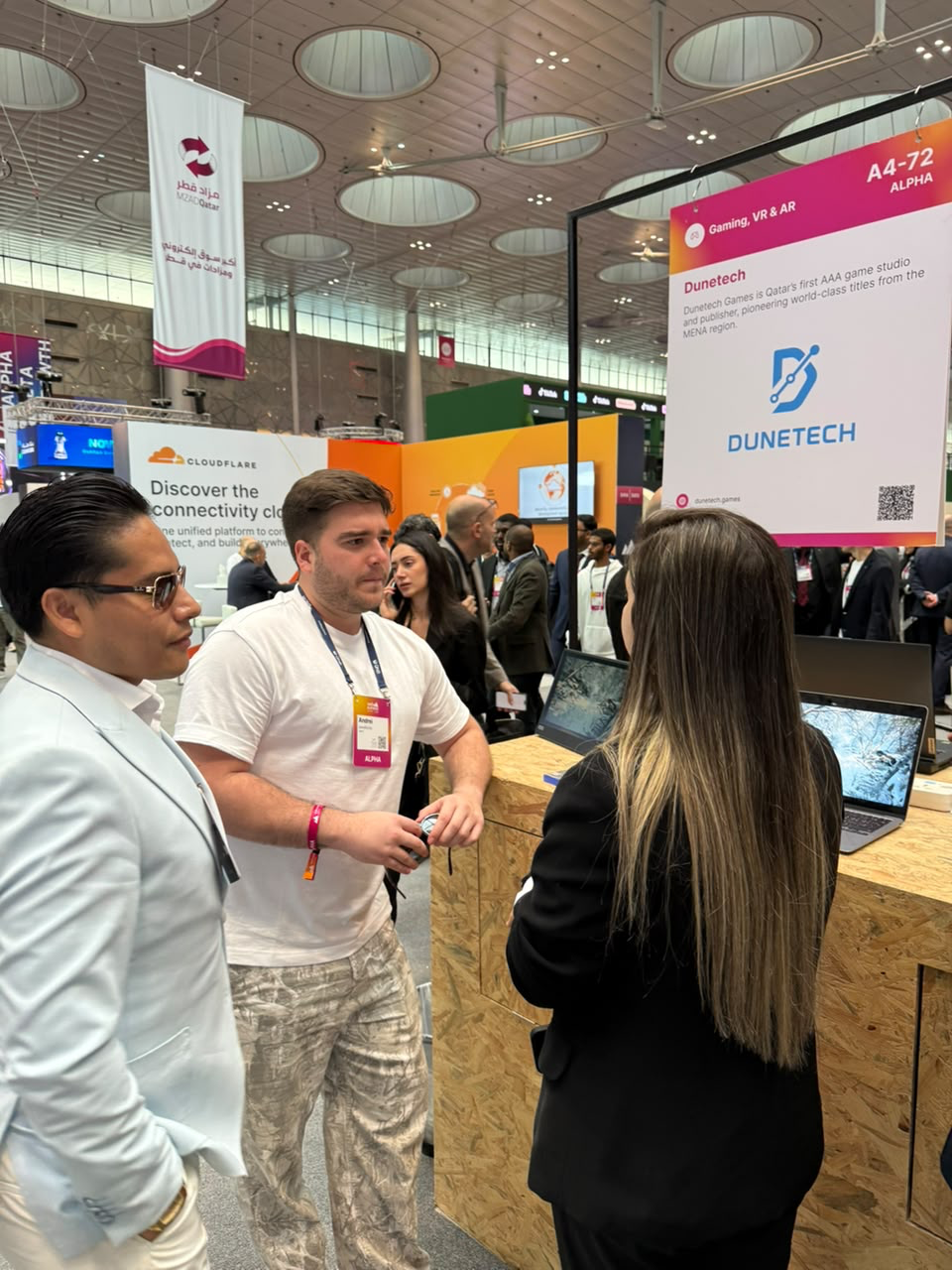 Edinson Carranza networking at WebSummit Qatar expo floor