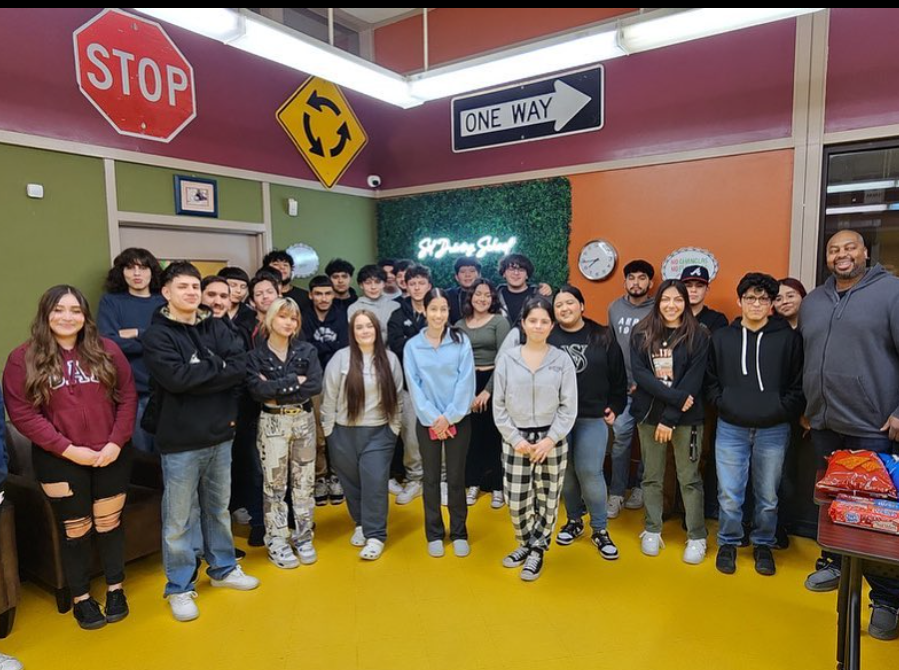 SOL Driving School students and staff group photo in the classroom
