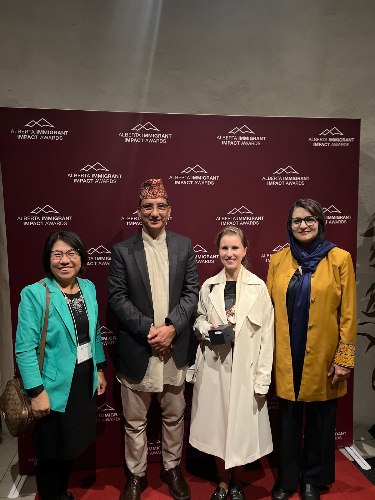 Latifah Majidi and community partners at the Alberta Immigrant Impact Awards