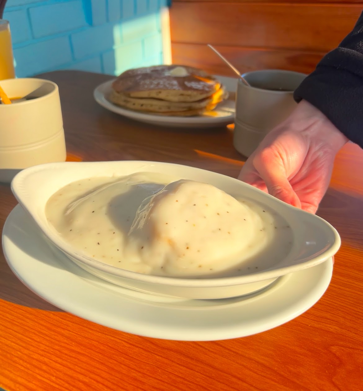 Biscuits and gravy with pancakes and coffee