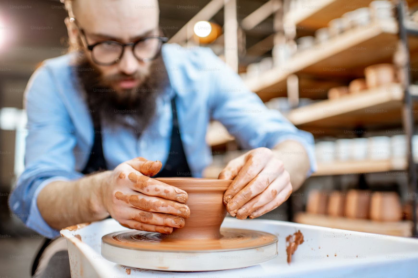 Artisan potter shaping clay