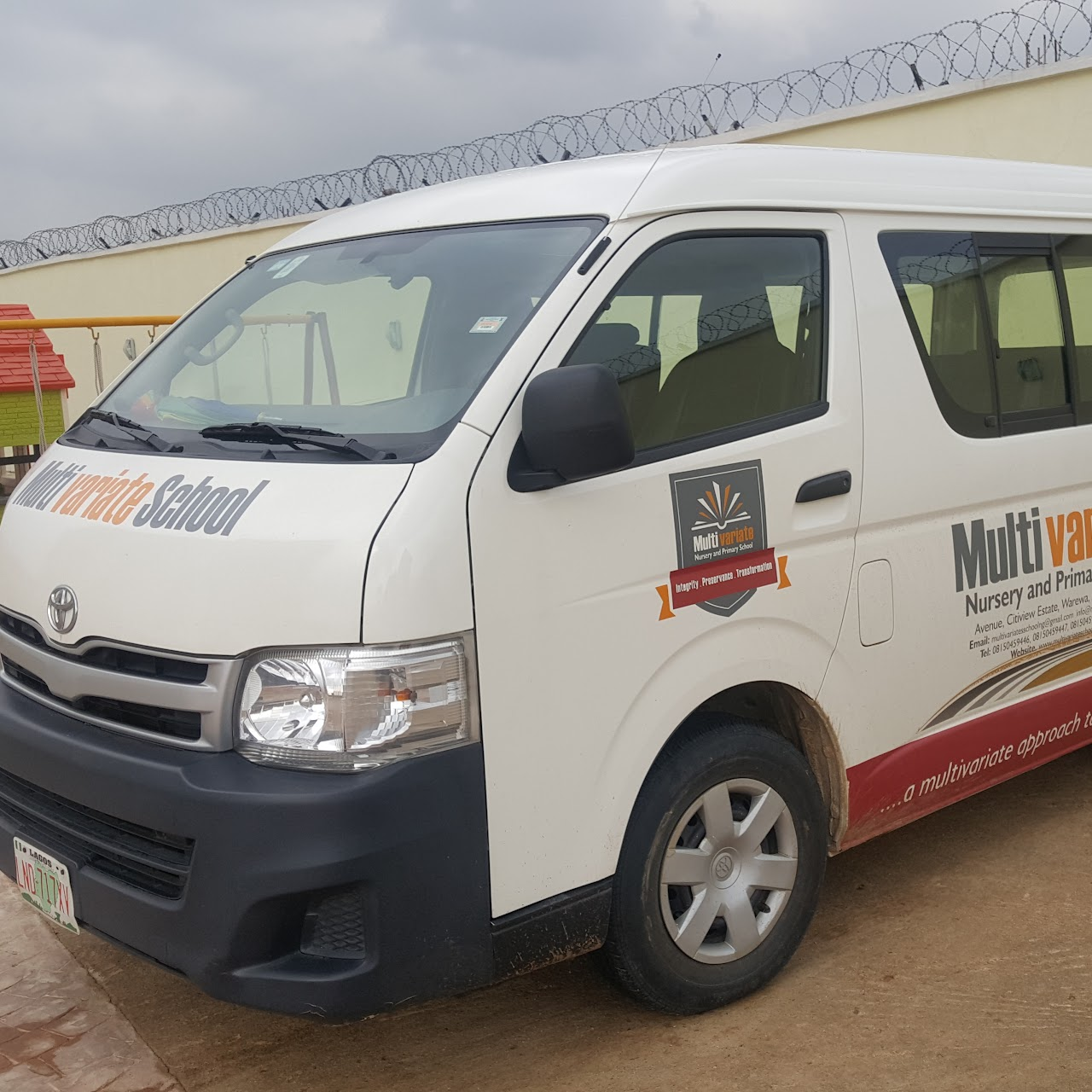 Branded Multivariate School bus parked in the school compound
