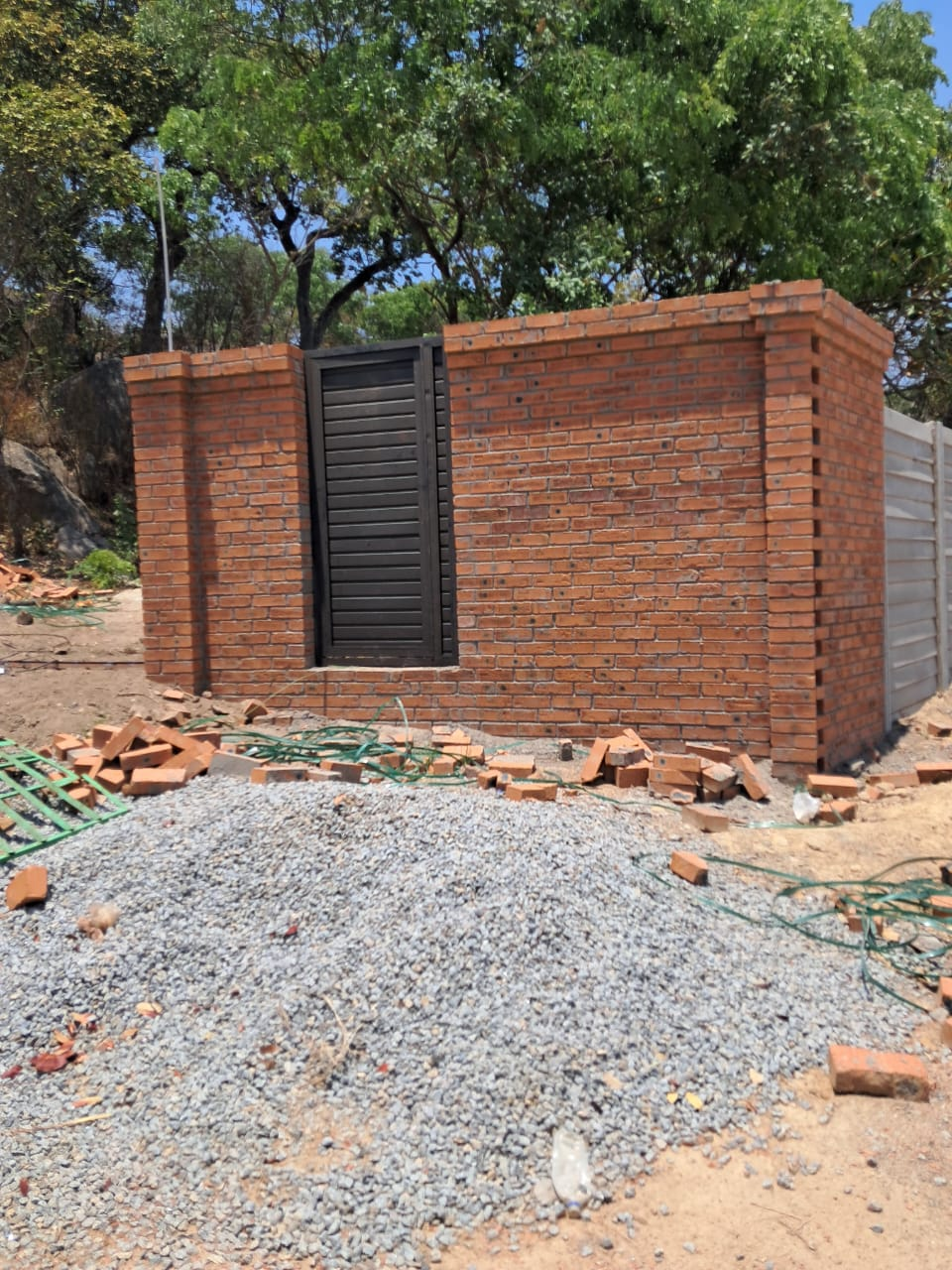 Brick wall and metal door construction