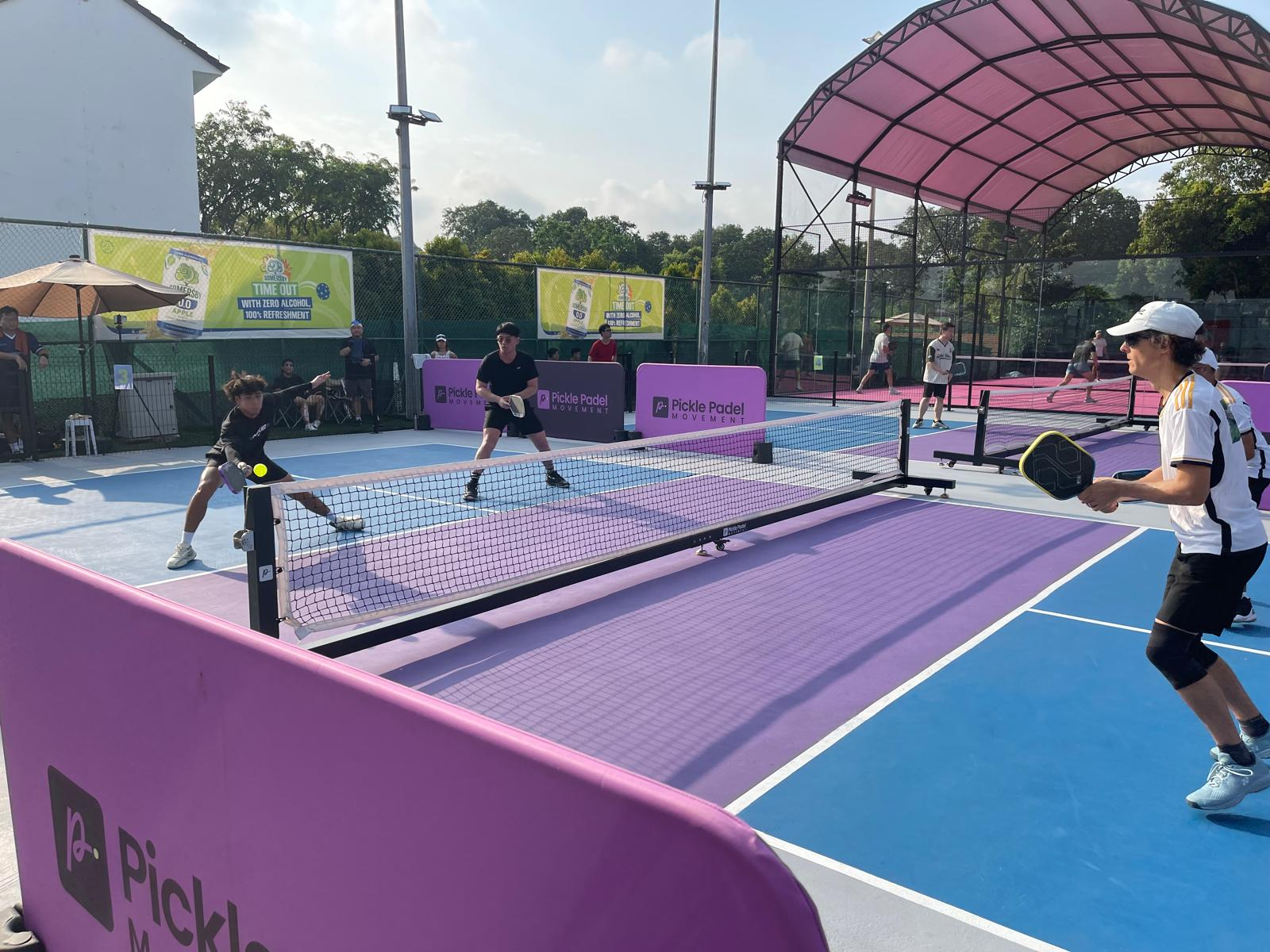 Players competing on Pickle Padel Movement outdoor court