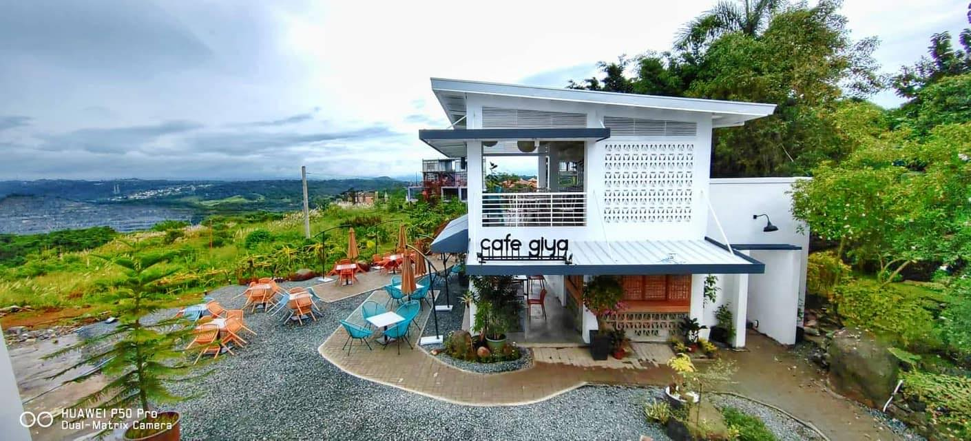 Cafe Giya exterior with mountain views and outdoor seating