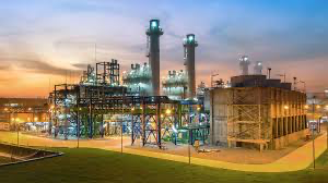 Oil and gas processing facility at sunset