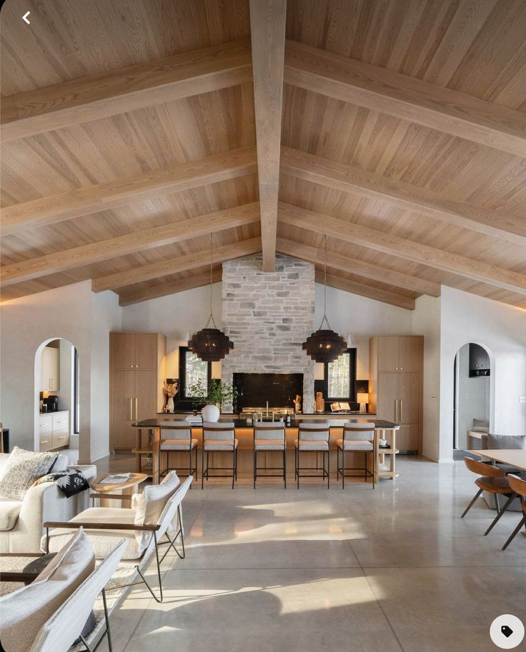 Luxury custom home interior with vaulted wood beam ceiling