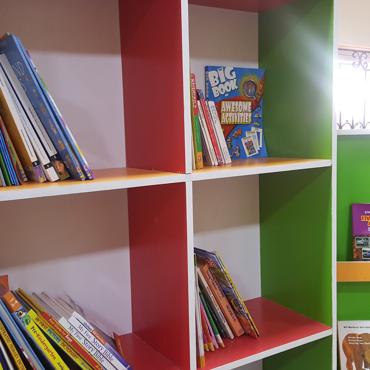 Library shelves stocked with colourful children's books