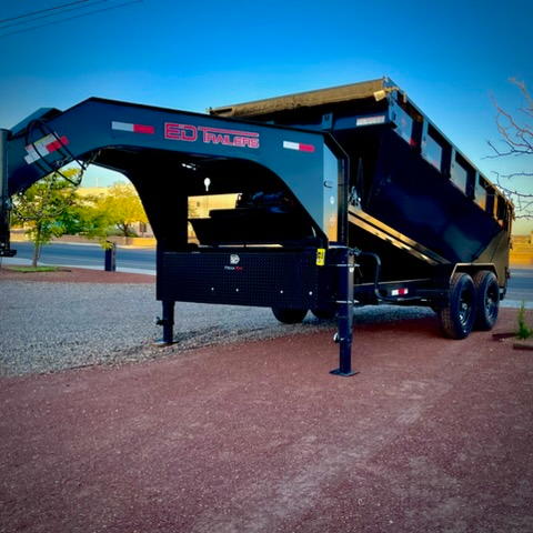 Roll-off dumpster at golden hour showing gooseneck hitch and toolbox storage