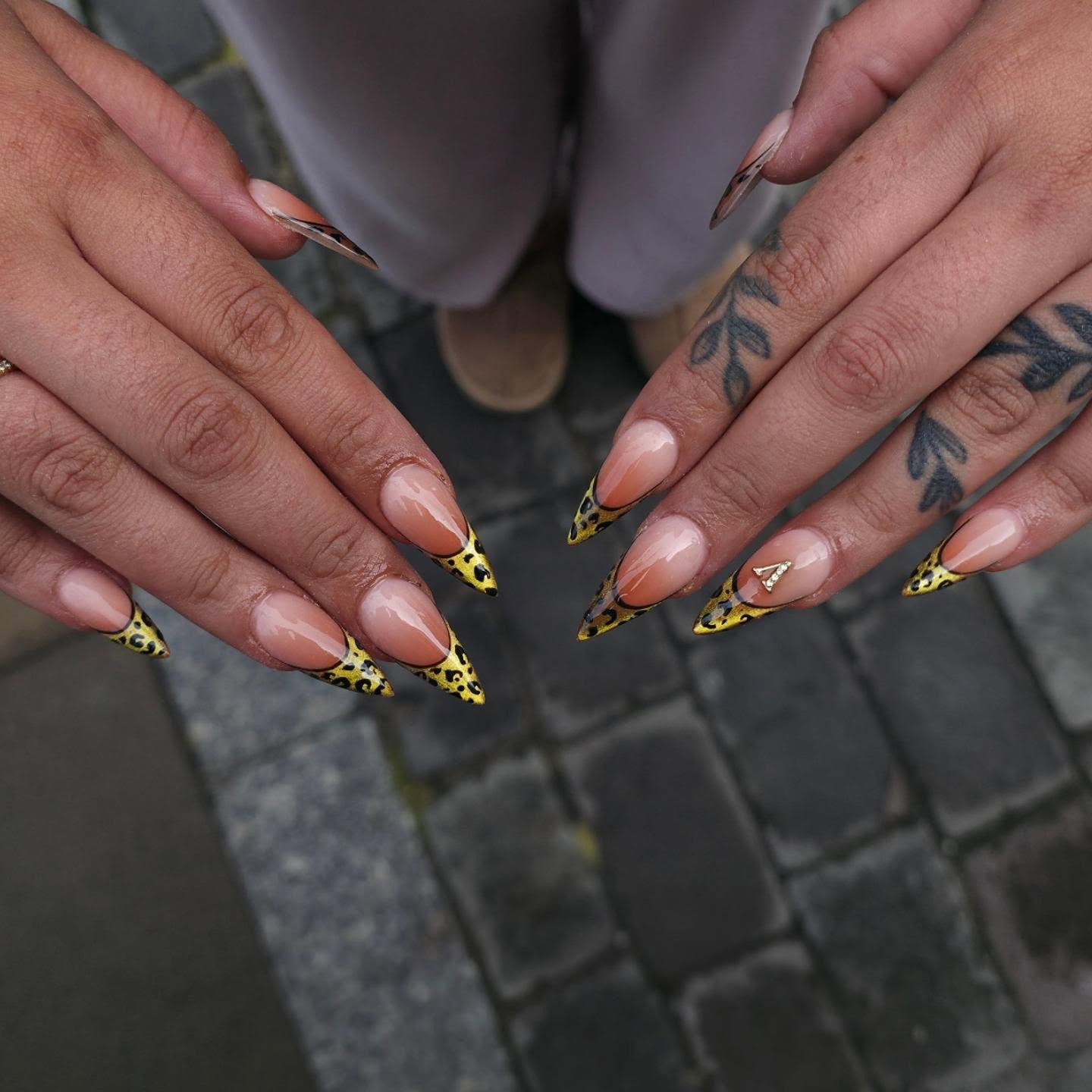 Yellow and gold leopard print nail art