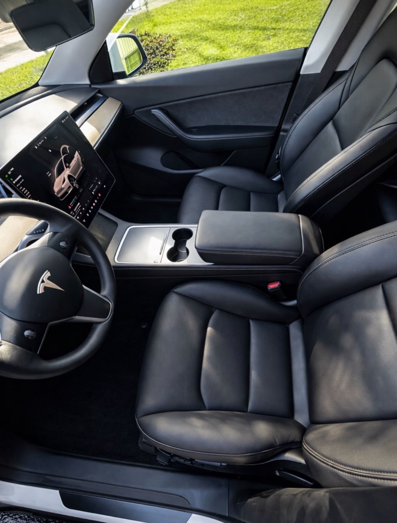 Pristine Tesla luxury interior with clean leather seats and immaculate detailing