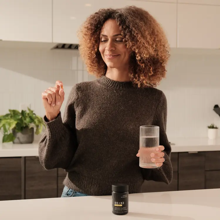 Woman taking vitamin