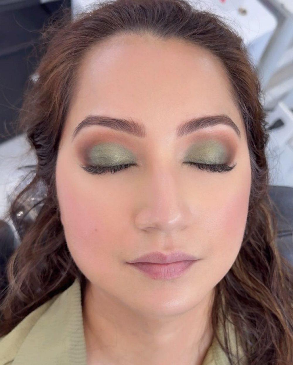 Green and gold eye makeup with smoky blend
