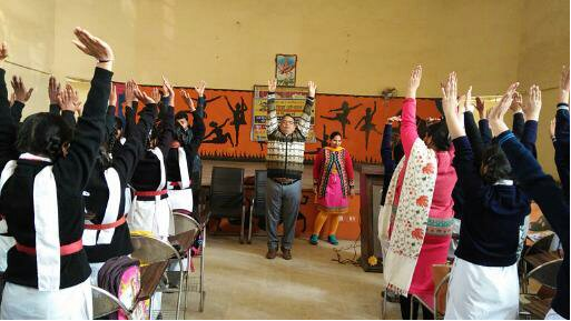 Classroom yoga class with participants doing yoga poses