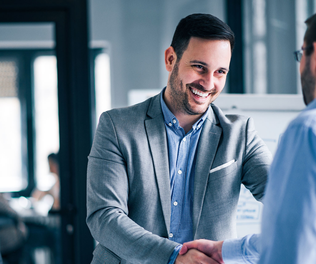 Sales professional shaking hands