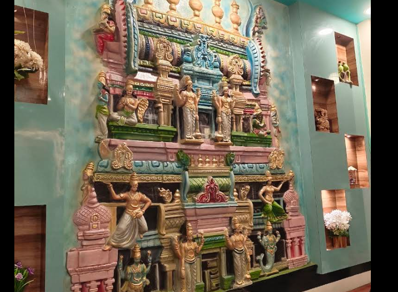 Colorful South Indian temple sculpture inside the restaurant