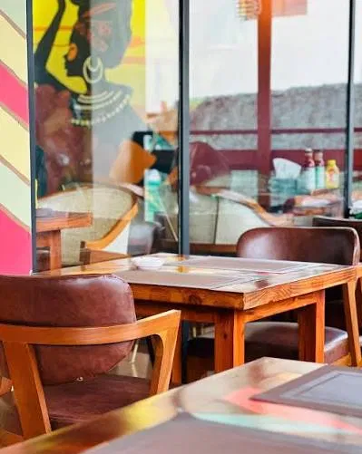 Wooden tables and leather chairs at Rumba