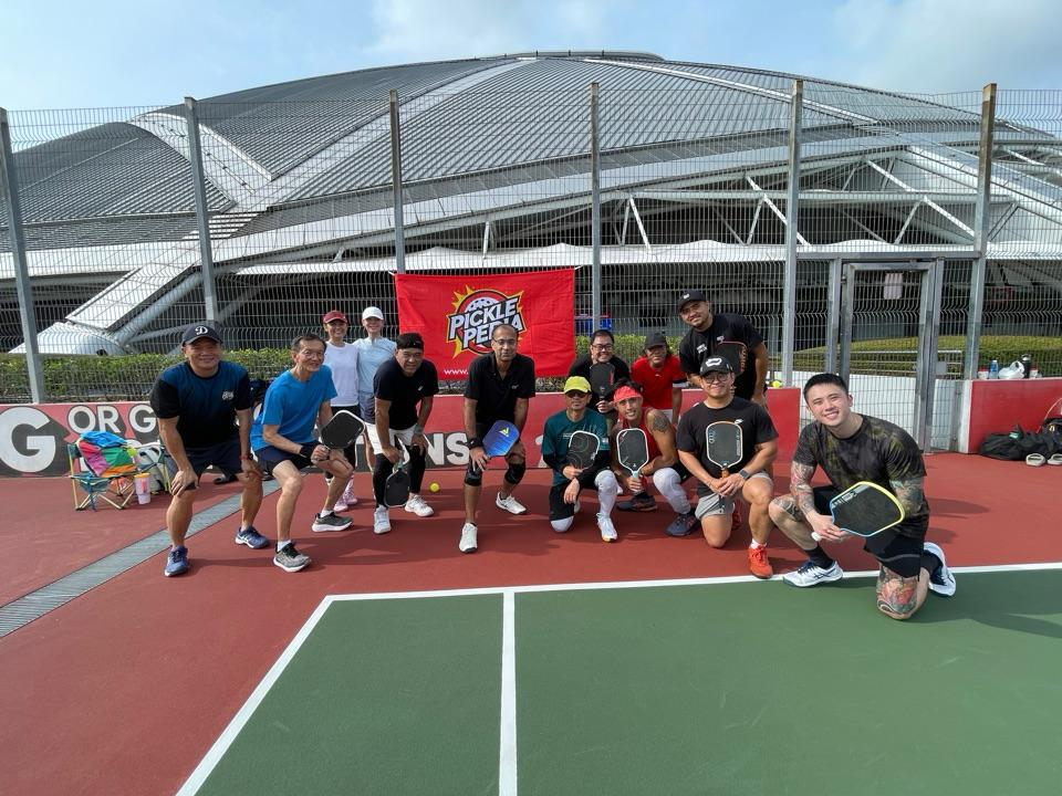 Picklepedia team group photo holding paddles