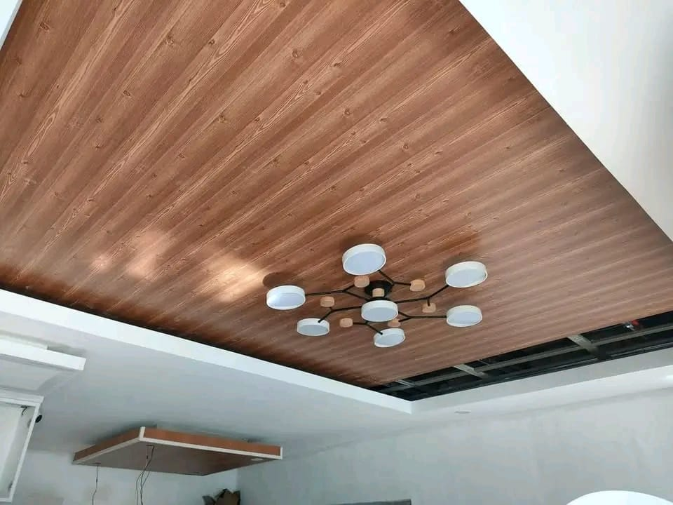Timber-lined ceiling with a statement light