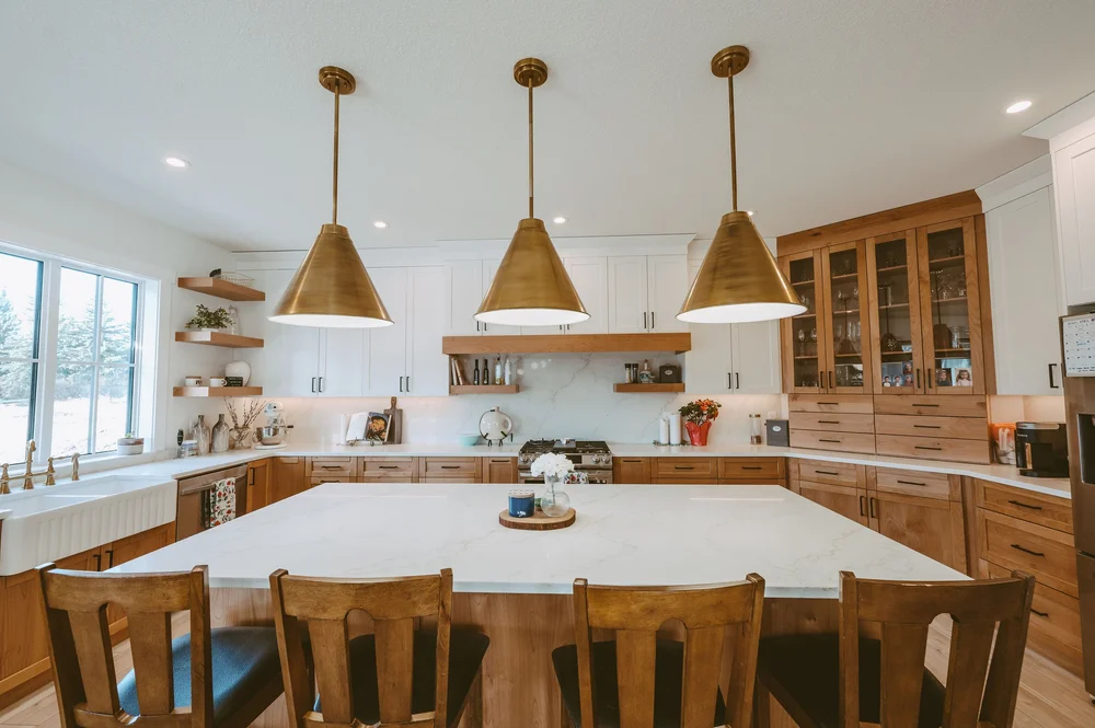 Kitchen island with brass pendants