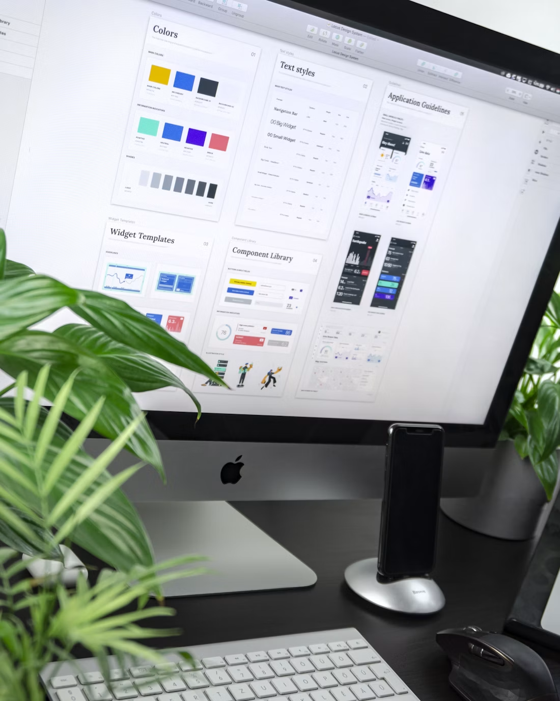 Design system boards displayed on a desktop monitor
