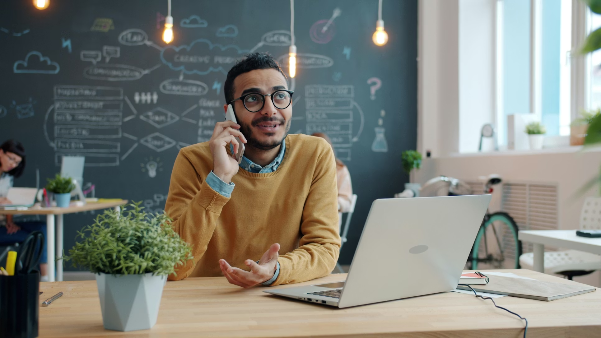 Professional on phone in creative office