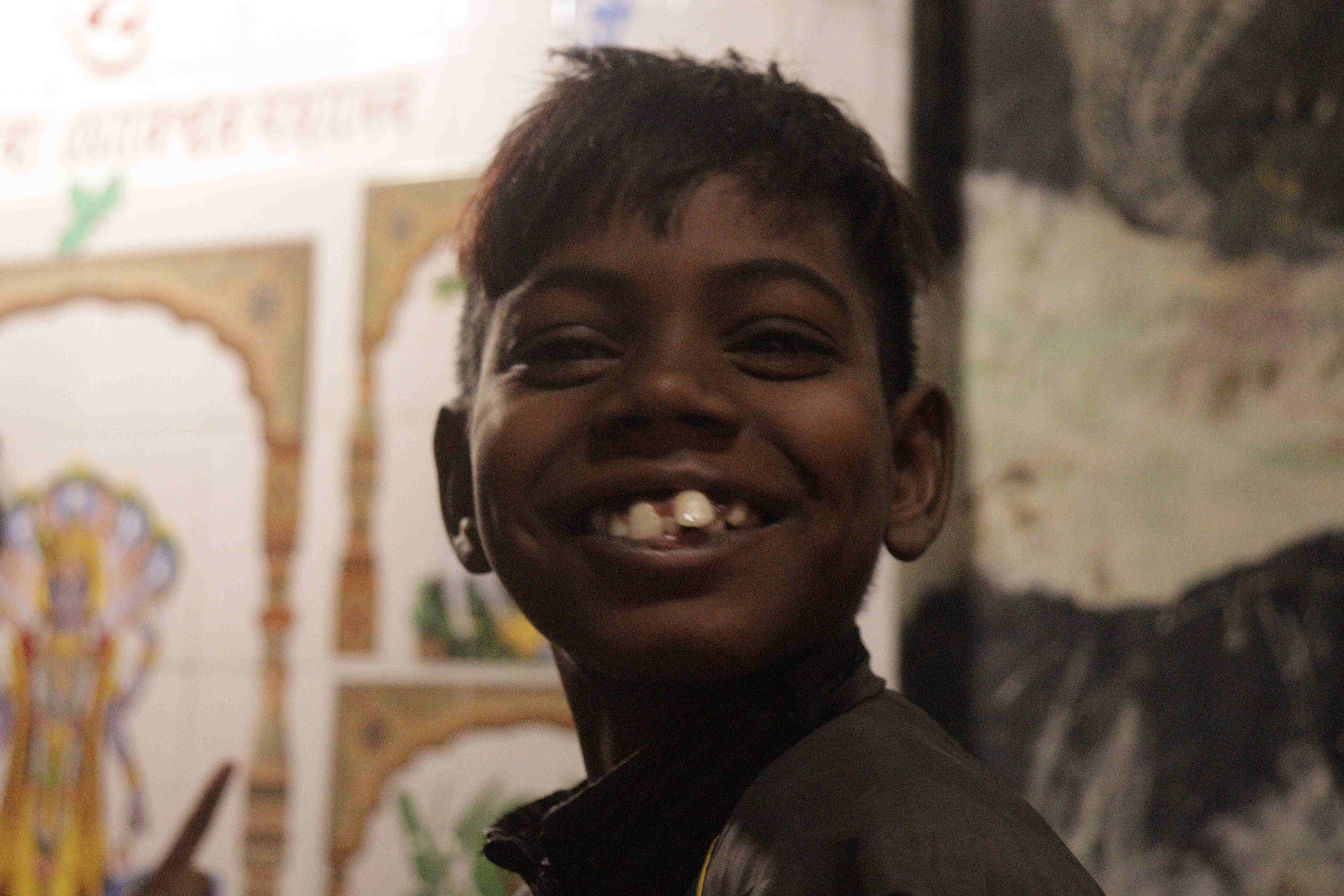 Child smiling in educational setting
