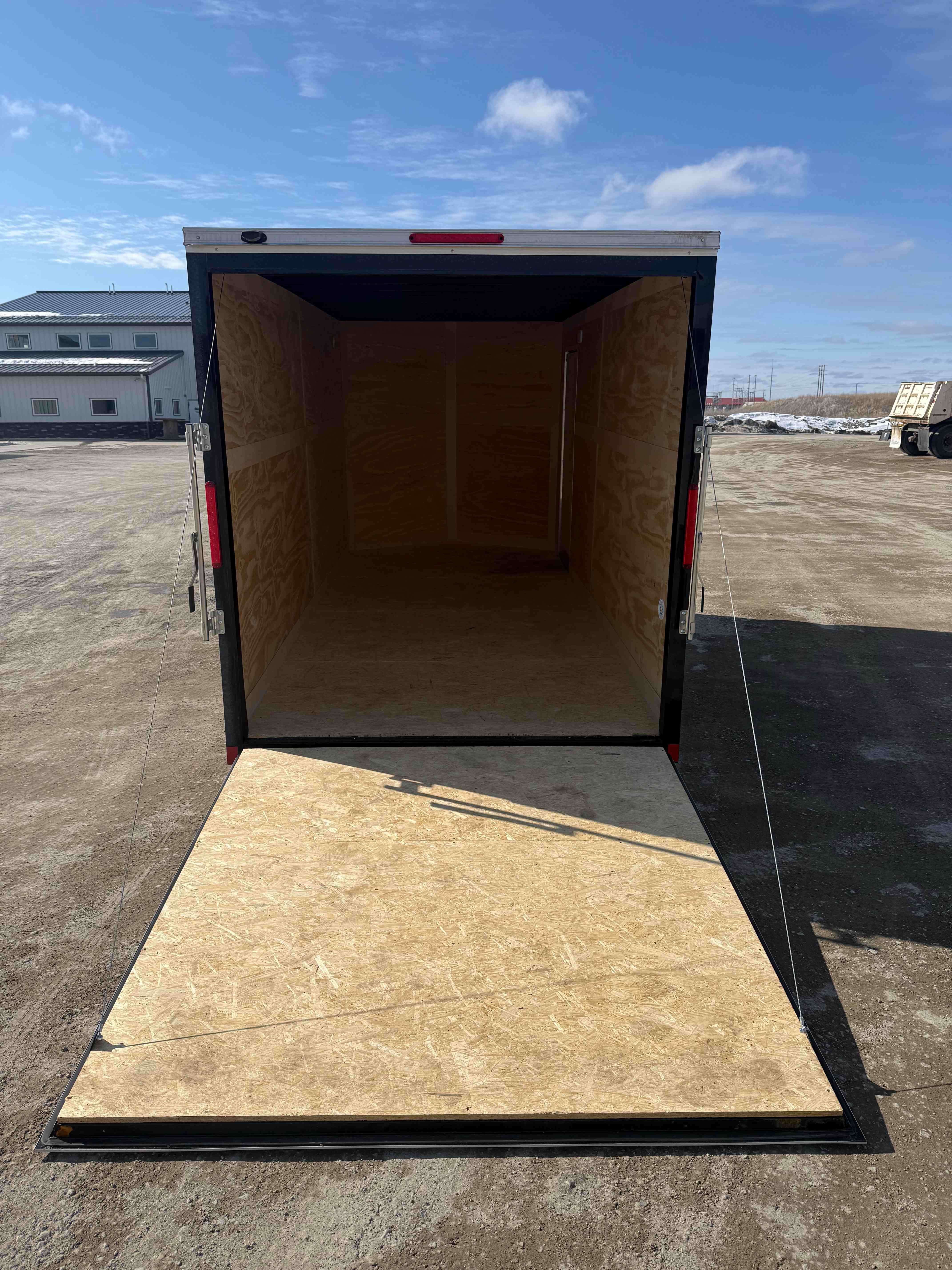 7x16 Cross enclosed trailer - interior view with open rear doors and lighting