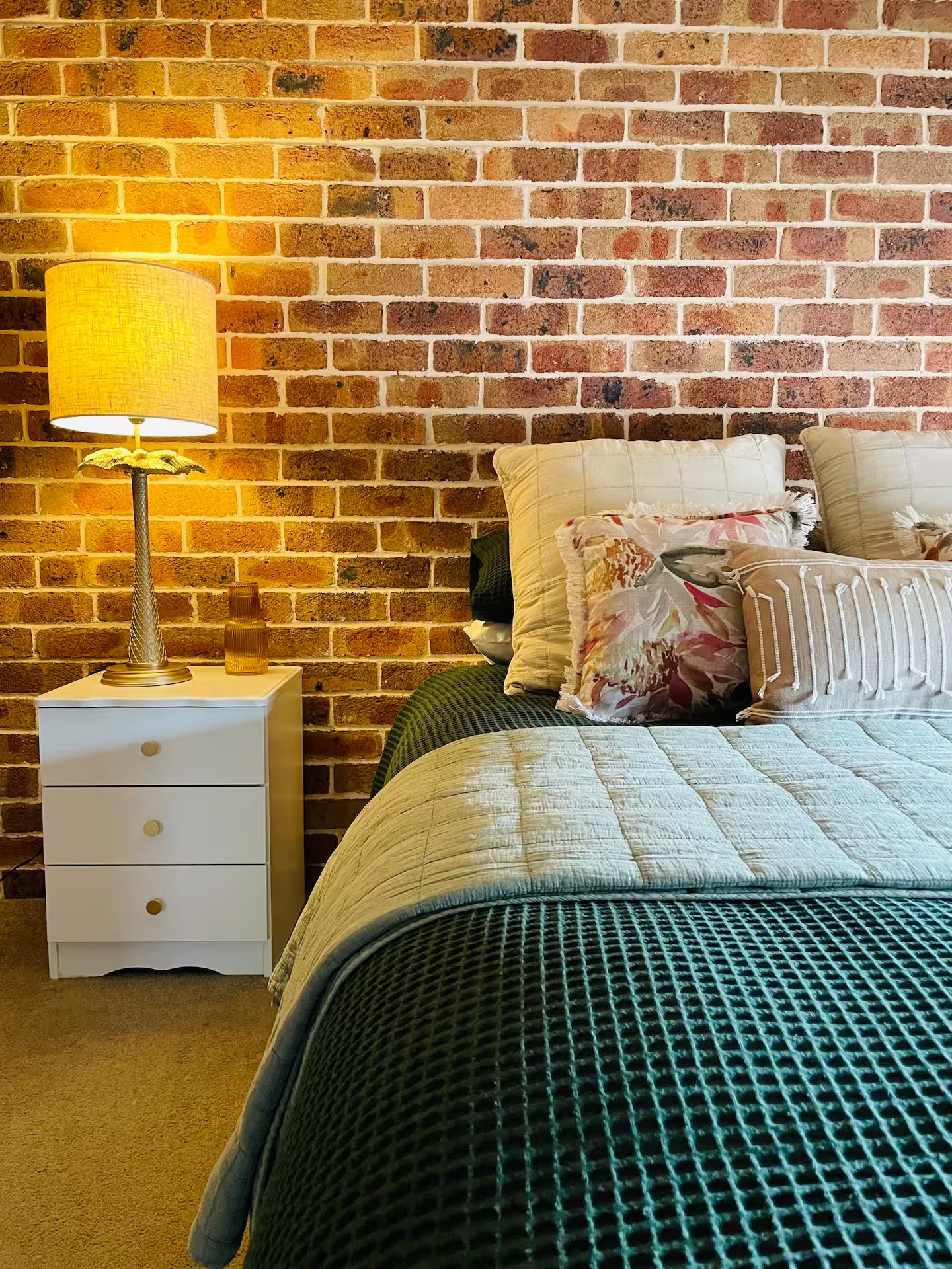 Cosy bedroom with exposed brick wall