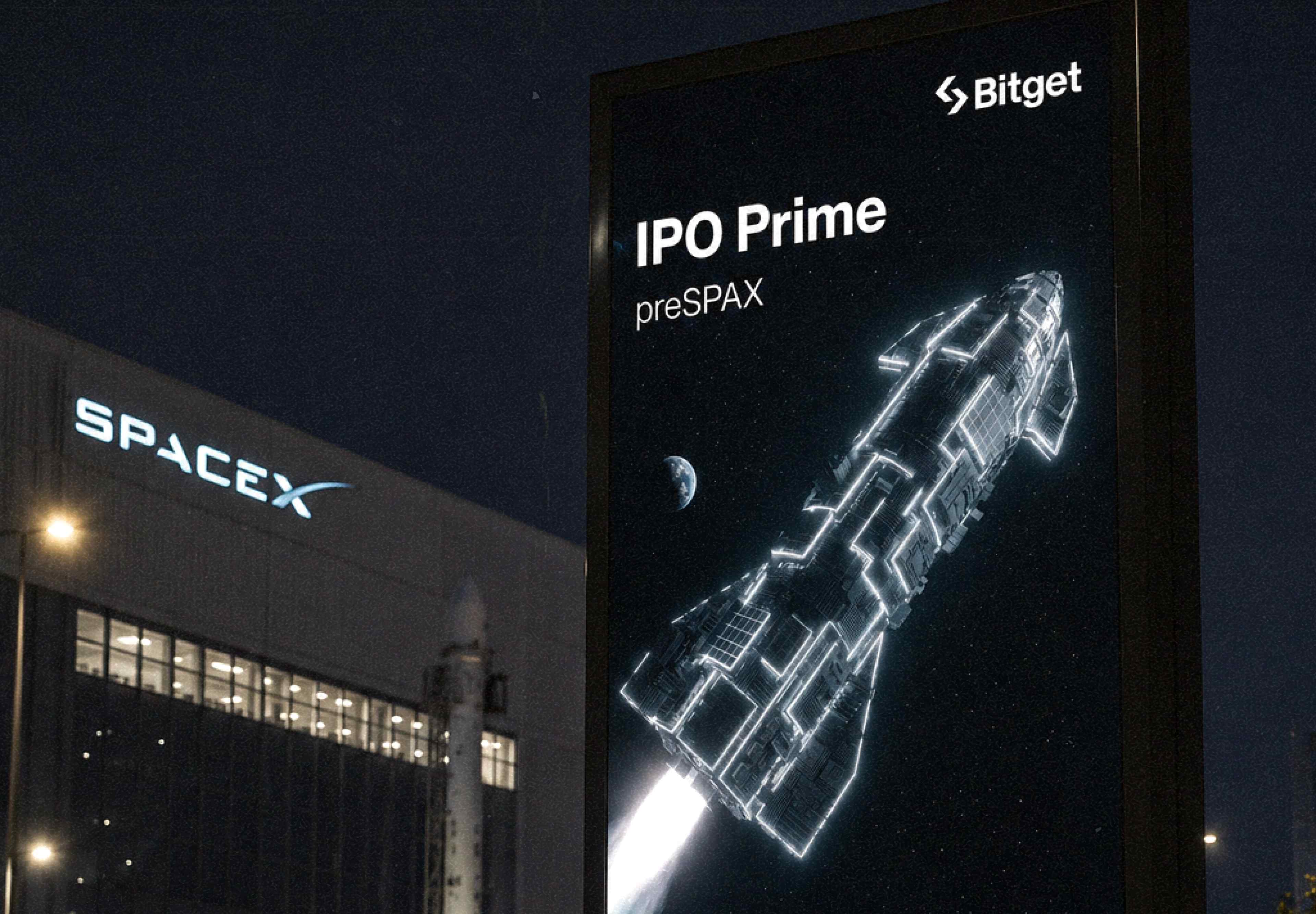 Bitget IPO Prime preSPAX portrait billboard outside SpaceX facility at night