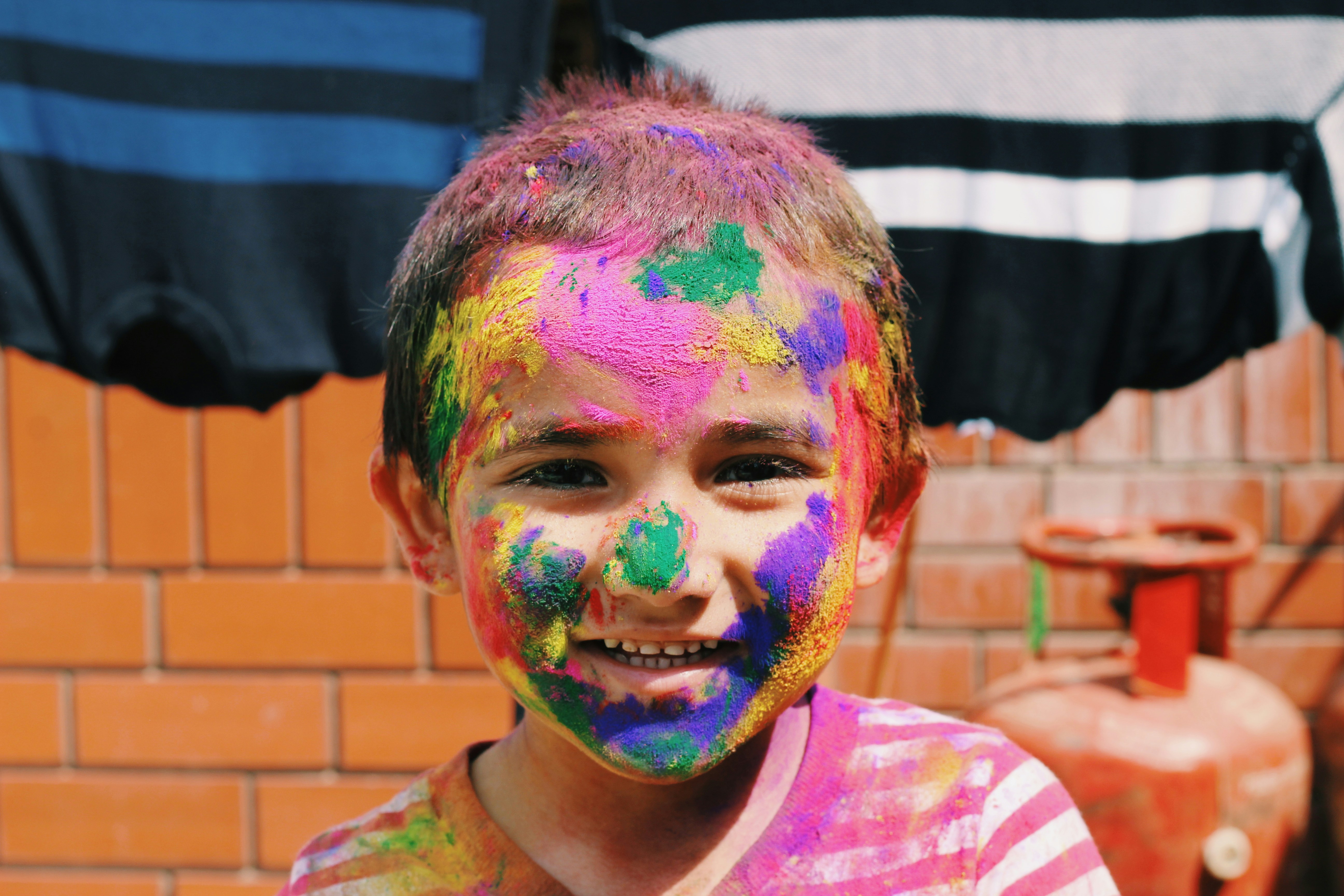 Growing Child - Child with colorful face paint
