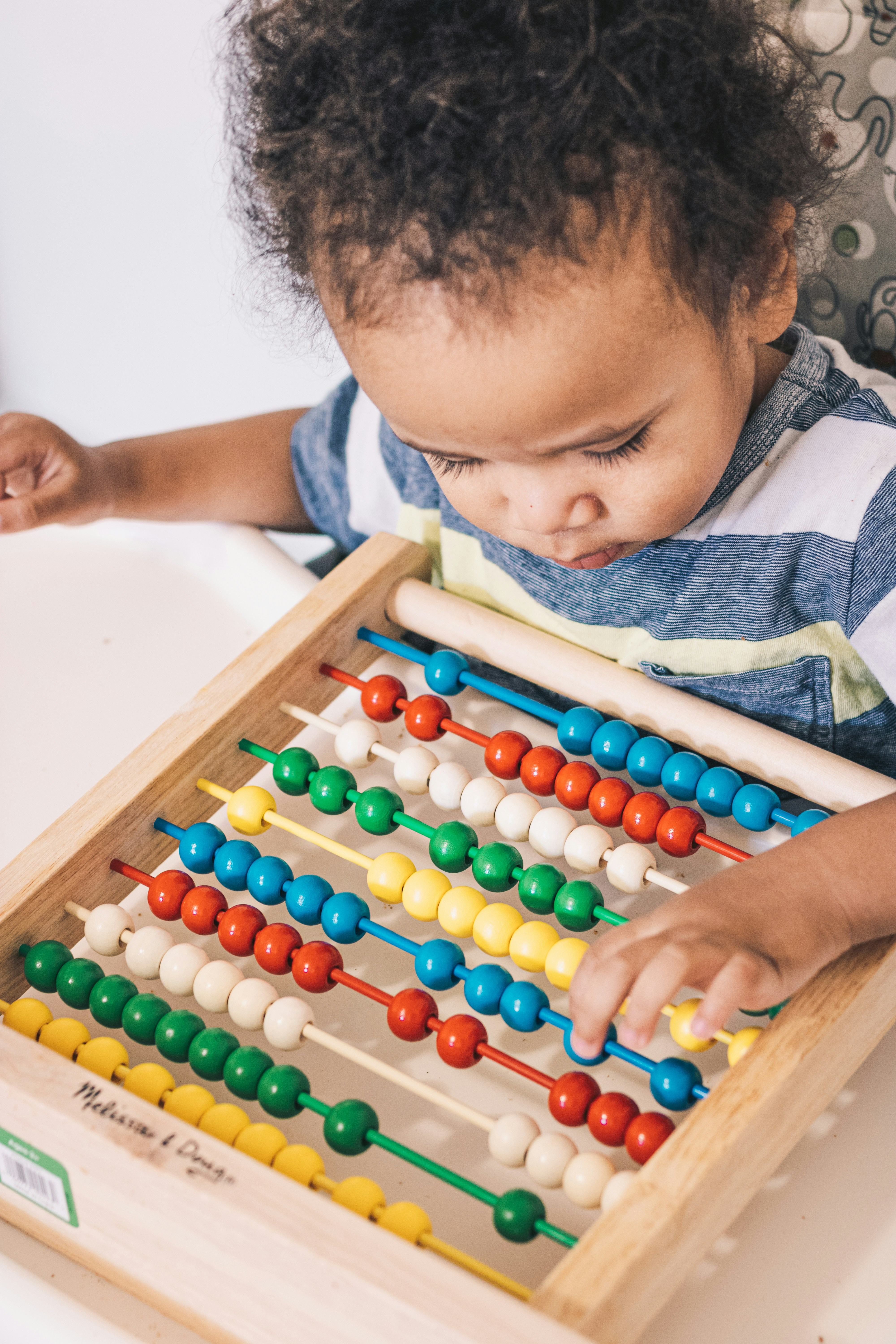 Toddler Care - Child with abacus