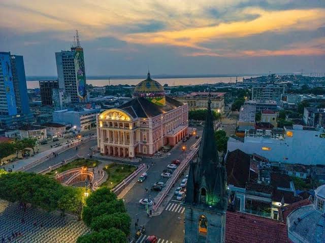 Aerial view of the Teatro Amazonas opera house at sunset in Manaus