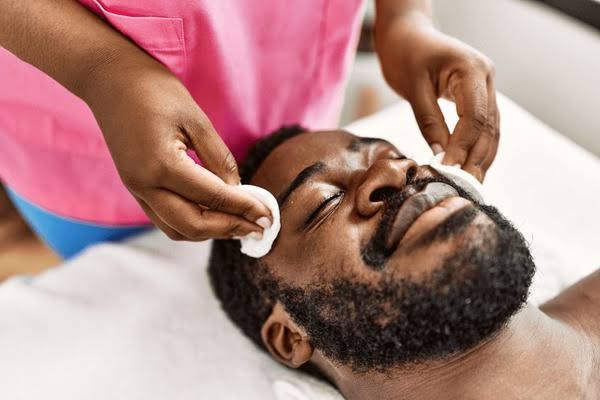 Man receiving facial treatment