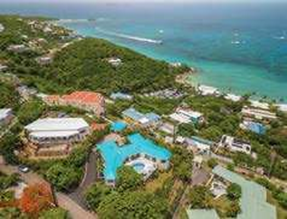 Aerial view of My Lady's Manor villa, hillside, and turquoise Caribbean ocean