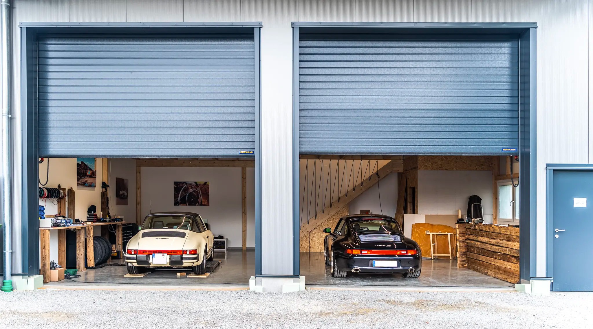 Professional restoration workshop with multiple vehicles