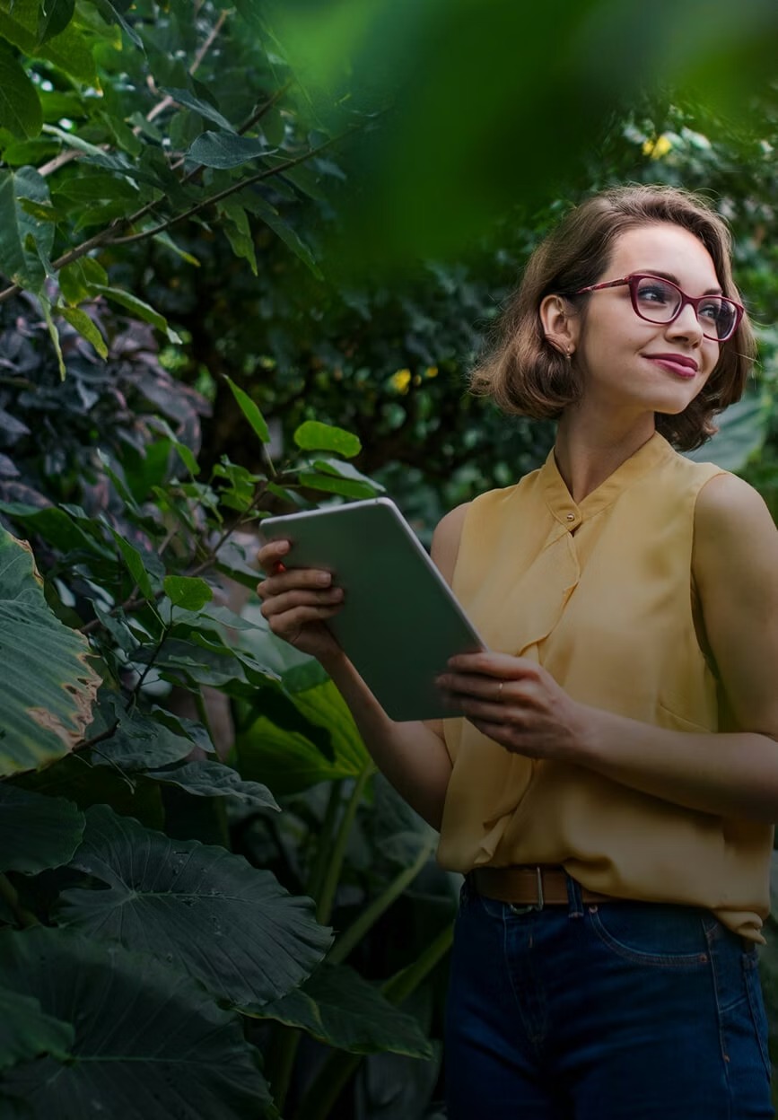 Team member in nature with tablet