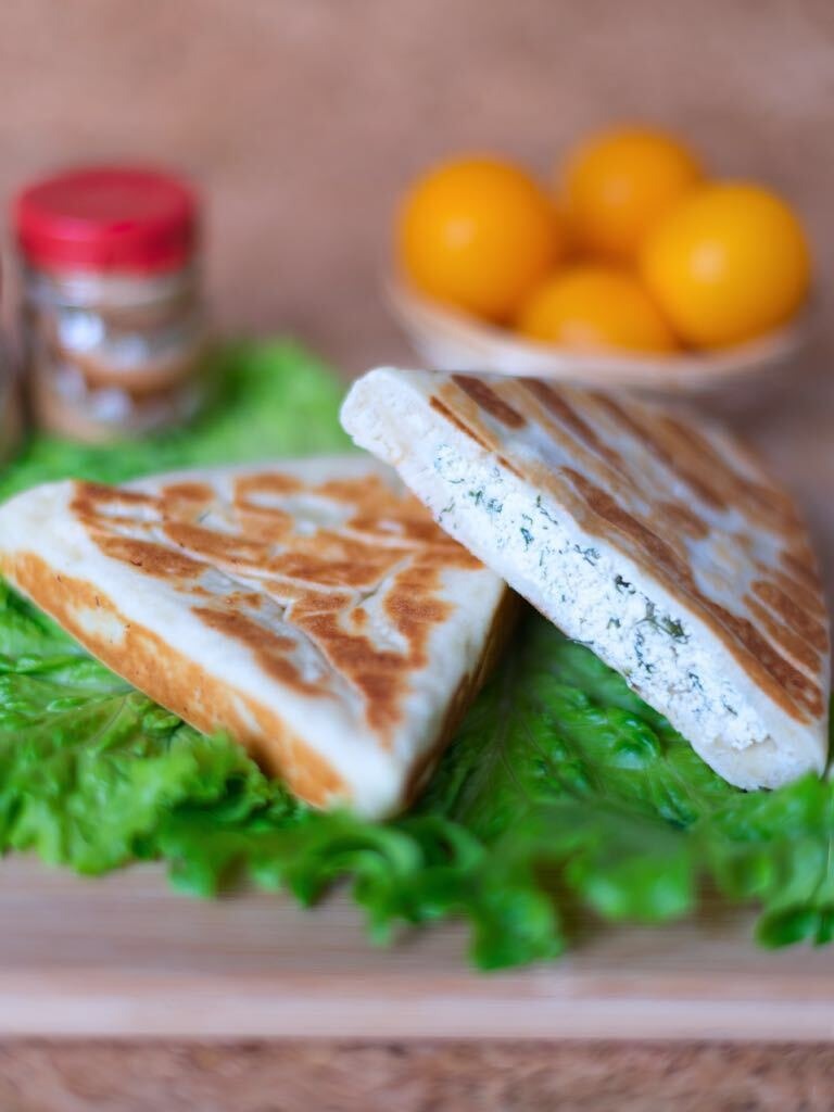 Sliced grilled product on lettuce